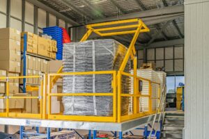 Roll-over pallet gate protecting products and offering safety to workers