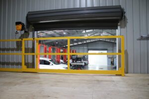 Roll-over pallet gate protecting products and offering safety to workers