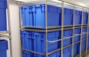 Chrome Wire Compactus with Blue Crates for patient Belongings